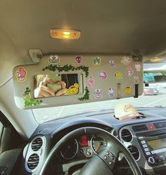 the interior of a car with various stickers on it's dash board and dashboard