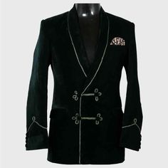 a black jacket with white trimmings and buttons on the lapel is sitting on a mannequin