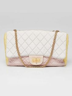 Chanel Tricolor Reissue 2.55 Quilted Canvas 227 Jumbo Flap Bag Description Go glam with this gorgeous Chanel 2.55 Reissue Quilted Classic 227 Jumbo Flap Bag. This large size is made of chic, quilted canvas and features a mademoiselle turnlock closure and double flap interior. The mademoiselle chain trap is versatile and can be worn on the shoulder or lengthened to wear with a longer drop. An elegant and timeless piece to add to any collection. Condition The exterior has some soiling on the corners, rubbing, and creasing. The hardware is smooth and shiny. The interior is soiled but remains in good condition despite having signs of use. Details Overall Condition: Gently used Exterior Condition: Gently used Interior Condition: Gently used Includes: Booklets Material: Multicolor quilted canvas Chanel 2, Flap Bag, Tri Color, Chain Strap, Timeless Pieces, Large Size, Bags Handbags, Zip Pockets, Chanel