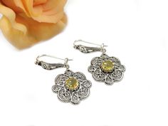 "Citrine 925 Sterling Silver Flower Women Dangle Earrings, Handcrafted Filigree Art Boho Dangle Drop Earrings The length is 1.60\" and width is 0.80\". The weight is 5.00 gr. Citrine gemstone is 6 mm faceted rose-cut, round-shaped. Comes with a free velvet pouch, silver polish cloth and a luxurious gift box. Filigree is made of delicate metal strands that have been skillfully fashioned to create an outstanding combination of old and modern art. Originating in Mesopotamia, Anatolia. It is made of Yellow Earrings With Intricate Design For Gift, Flower Women, Art Ancien, Filigree Jewelry, Silver Polish, Citrine Gemstone, Velvet Pouch, Sterling Silver Flowers, Etsy Earrings Dangle