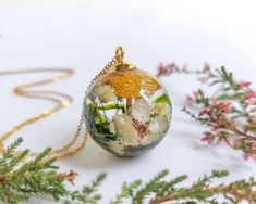 Let me bring you the most beautiful creation. It is not made by me. It is made by nature. A beautiful real mushroom necklace, a moss resin necklace that belongs to my cottagecore jewelry. Make this mushroom terrarium necklace your perfect complement full of color, shine and elegance. A nature lover gifts idea to stand out on formal occasions or on those other more casual ones. Only you will know how to properly combine this real mushroom necklace from my magic forest jewelry to look beautiful wh Nature-inspired Flower Necklace With Round Pendant, Nature-inspired Round Pendant Flower Necklace, Nature-inspired Birth Flower Round Pendant Necklace, Nature-inspired Flower Charm Round Pendant Necklace, Nature-inspired Birth Flower Necklace, Unique Flower-shaped Birth Flower Necklaces, Unique Birth Flower Necklace, Nature-inspired Birth Flower Necklace Keepsake, Nature-inspired Flower Pendant Necklace Gift