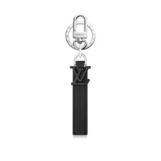 LOUIS VUITTON® - Lv Aerogram Key Holder And Bag Charm - Black Modern Black Bag With Metal Logo, Modern Black Bags With Metal Logo, Elegant Black Bag With Logo Charm, Luxury Black Bag With Logo Charm, Black Louis Vuitton, Trendy Glasses, Charm Collection, Louis Vuitton Official, Leather Logo