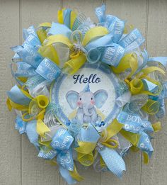 a blue and yellow wreath with an elephant on it