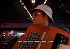 a man in a white hat and sunglasses is holding a computer keyboard with the caption i'm a relatively resectable citizen