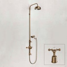 an old fashioned shower head and hand shower faucet with thermostaer