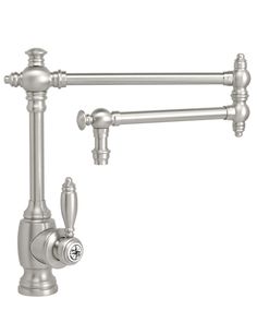 a kitchen faucet with two handles and nozzles