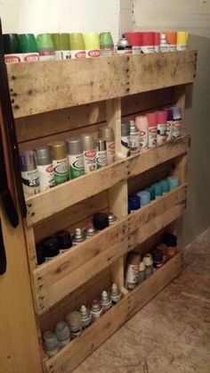 a wooden pallet filled with lots of paint