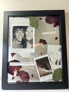 a black frame with pictures and leaves on it