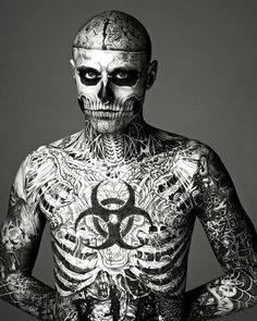 a man with lots of tattoos on his body