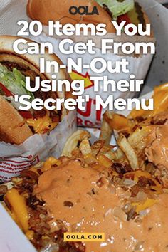 a basket filled with lots of food next to fries and coleslaw on the side