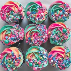 cupcakes decorated with colorful frosting and sprinkles