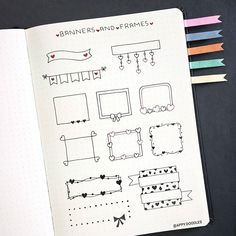 an open notebook with various hand drawn frames and ribbons on the page, next to colored pencils