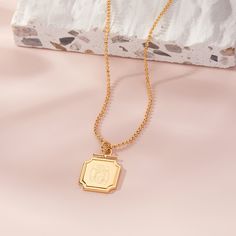 Angular details and a delicate ball chain create a simple, but chic pendant necklace that you and your BFF will wear on repeat. Available in 14k gold plated, rhodium plated or 14k rose gold plated brass Pendant size: 3/4" 16" diamond cut ball chain with 2" extender Lobster claw closure Made in the USA With engraving this item is FINAL SALE SKU: BYN1252 Personalized Chic Yellow Gold Jewelry, Chic Personalized Yellow Gold Jewelry, Chic Tarnish-resistant Charm Necklace Gift, Trendy Personalized Pendant Jewelry, Personalized Metal Pendant Initial Necklace, Personalized Metal Initial Pendant Necklace, Personalized Gold Dog Tag Jewelry, Chic Charm Jewelry For Gifts, Chic Charms Jewelry As A Gift