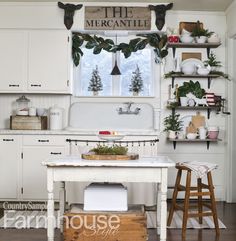 the kitchen is decorated for christmas with white cabinets and wooden stools in front of an old - fashioned stove