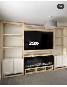 an entertainment center with built in cabinets and a flat screen tv mounted to the wall