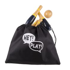 two wooden mallets in a black bag with hey play written on the front and bottom