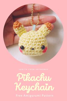 a hand holding a small crocheted keychain with the words pikachu keychain on it