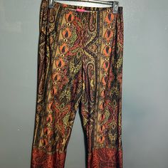 This Is A Pair Of Women’s Palazzo Pants. They Are A Brilliant, Vibrant, Set Of Colors In Orange, Brown, And Muted Gold. They Are Made By Sunny Leigh. They Are Size Extra Large. They Are Like Brand New. #112. Orange Pants For Fall Loungewear, Stretch Orange Pants With Elastic Waistband, Casual Orange Stretch Wide Leg Pants, Casual Stretch Orange Wide Leg Pants, Orange Wide-leg Loungewear Bottoms, Orange Wide-leg Pants For Loungewear, Orange Stretch Wide-leg Bottoms, Orange Straight Lounge Pants, Orange Straight Pants For Loungewear