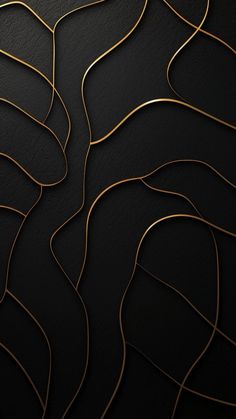 an abstract black and gold background with wavy lines in the center, on top of a dark surface