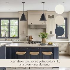 a kitchen with blue cabinets and white counter tops, an island in the middle has stools on it