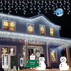 a house decorated with christmas lights and snowmen