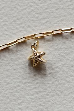 14K Gold filled dotted Starfish charm is sure to remind you of Laguna Beach and is sweet on an ocean themed charm necklace. This is fun yet easy to mix with all other charm styles. Hand make your custom charm necklace in Laguna Beach or build your piece online through adding a base necklace and your selection of charms. Leave us a note on your order for any special requests. Gold filled Tarnish resistant 3D charm Ocean-inspired Jewelry With Starfish Charm As Gift, Ocean-inspired Jewelry With Starfish Charm For Gift, Gold Star Charm Necklace For Beach, Ocean-inspired Gold Jewelry With Starfish Charm, Gold Charm Necklace With Star Charm For Beach, Gold Charm Necklace With Star For Beach, Starfish Charms Jewelry For Gifts, Star Charm Necklace For Beach, Starfish Charms Jewelry As Gift