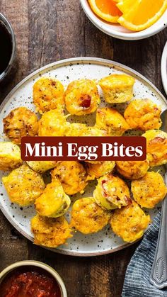 mini egg bites on a plate with sauce and oranges