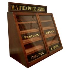 a display case with many different types of books on it's front and sides