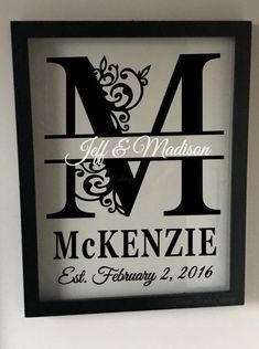 a black and white framed monogrammed wedding sign