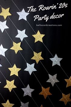 the room's party decor is decorated with gold and silver stars on black paper