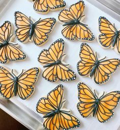 there are many butterflies that are on the tray