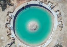 an aerial view of a lake surrounded by land