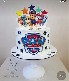 a cake with paw patrol decorations on it