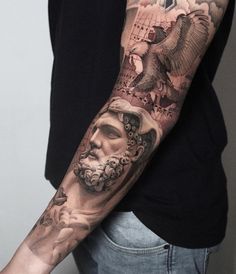 a man's arm with an eagle and some pictures on it