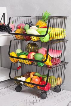 three tiered metal fruit basket on wheels