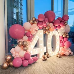 a balloon arch with the number forty displayed