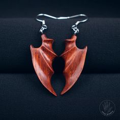 Dragon Wings Wooden Earrings - Crafted from padauk wood, these earrings are a masterpiece of craftsmanship and sophistication. Each pair is unique, handmade using natural padauk wood. These earrings are exceptionally lightweight yet durable and resilient. They will complement your look, accentuating your individuality and style.    [CARE] The earrings is sealed with two or more layers of wood oil in order to protect the wood against moisture and the environment. The oil makes the earrings moistu Handmade Wood Drop Earrings, Handmade Wooden Drop Earrings, Handmade Artisan Wood Earrings, Artisan Wood Handmade Earrings, Unique Natural Wood Earrings, Traditional Handmade Mahogany Jewelry, Wooden Earrings Handmade, Padauk Wood, Dremel Crafts