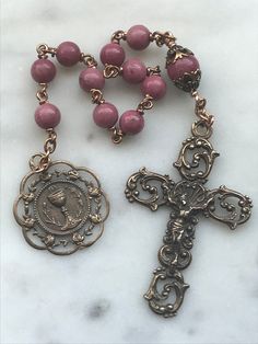 Beautiful First Communion pocket rosary. 6 and 8mm Rhodonite Gemstones 20 gauge solid bronze wire Bronze Medals Antique Jewelry With 8mm Beads For Gift, Antique 8mm Beads Jewelry As Gift, Antique Jewelry With 8mm Beads As Gift, Antique 8mm Beads For Jewelry Making, Antique Gold Rosary As Gift, Bronze Rosary As Gift, Bronze Rosary With Round Beads As Gift, Vintage Bronze Rosary As Gift, Antique Handmade Rosary As Gift