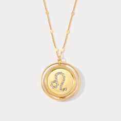 a gold necklace with the letter j on it