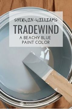 a paint can with a wooden handle and the words shekin williams tradewind painted on it