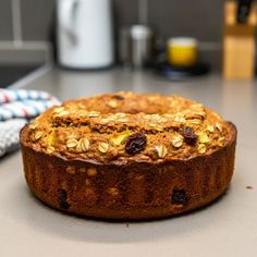 a cake sitting on top of a counter next to a knife