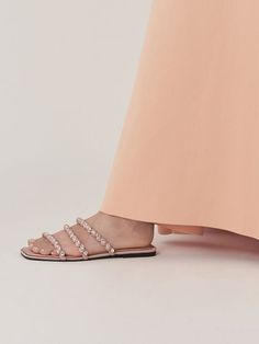 This product is made with at least 20% sustainable materials by weight. CHARLES & KEITH uses recycled, degradable, organic, and water-based materials in our eco-conscious collection. These Goldie slide sandals prove that you do not have to sacrifice comfort for style. In light pink, they exude a soft elegance that is understated enough for casual, everyday wear. The gem-encrusted embellishments along the straps immediately take these sandals to the next level, reflecting a rainbow-like iridescence and shine when they catch the light. For added comfort, they also come with padded insoles made from smooth recycled polyester that are so comfy, you will want to walk in them all day long. Charles Keith, Casual Everyday, Slide Sandals, Trending Shoes, Kid Shoes, Walk In, Clothes For Sale, Light Pink, Embellishments