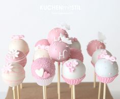 cake pops with pink and white frosting on sticks