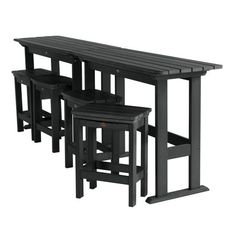 the table and stools are all made out of black wood with one bench on each side