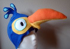 a blue and orange bird hat on top of a mannequin's head