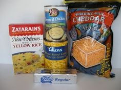 an assortment of food items are displayed on a counter top in front of a bag of cheddar cheese