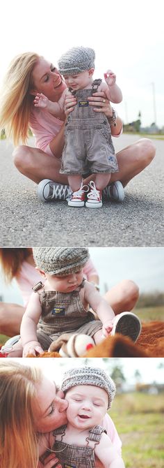 two women and a baby are sitting on the ground, one is kissing the other