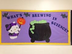 a bulletin board with an image of a witch and a cat in a caulder