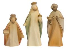 three nativity figurines are shown on a white background