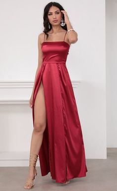 Take this stunning red satin maxi from day to night! Features a classy tie-back for the perfect fit and sexy high slits on the skirt. Dress it up with crystal accents and let the compliments come all day and night long!

	 

	Made In Los Angeles

	- 100% Polyester

	- Adjustable Straps

	- Hand Wash Cold

	Length of Dress Measures 57in/144.7cm.

	 

	All Measurements Are For A Size Small Dresses Gala, Red Satin Dress, Satin Dress Long, Maxi Dress Prom, Red Prom, Maxi Slip Dress, Satin Maxi, Maxi Dress Evening, Satin Maxi Dress